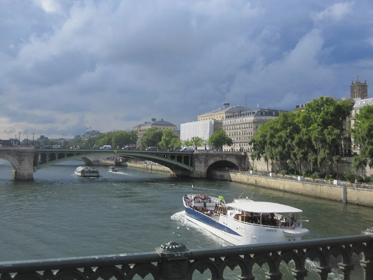 Dark storm clouds building over water ahead of a cold front
